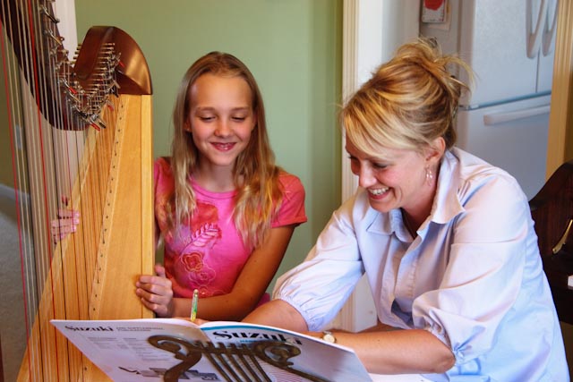 Laura Erickson teaching harp lessons in West Des Moines, Iowa